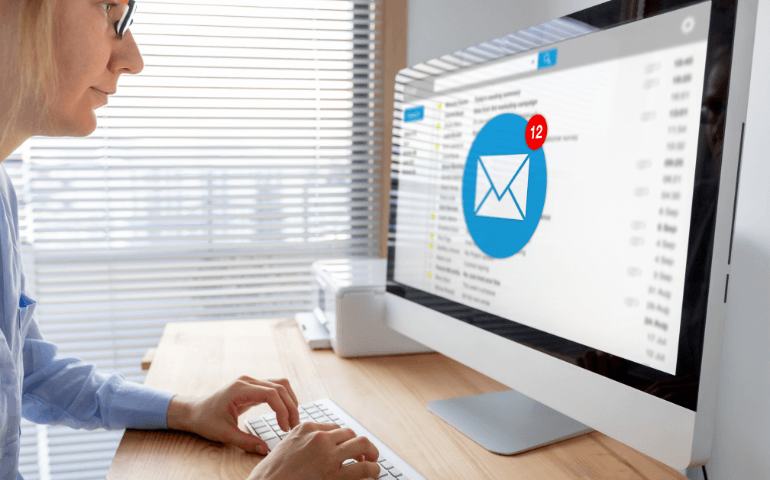 person reading emails on desktop